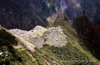 Machu Picchu lit up by sunlight, taken from the Sun Gate trail