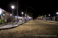 Puerto Villamil at night - restaurants in the main square.