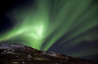 Aurora Borealis, Hveragerði, Iceland (9) Bright Auroral light illuminates the mountains