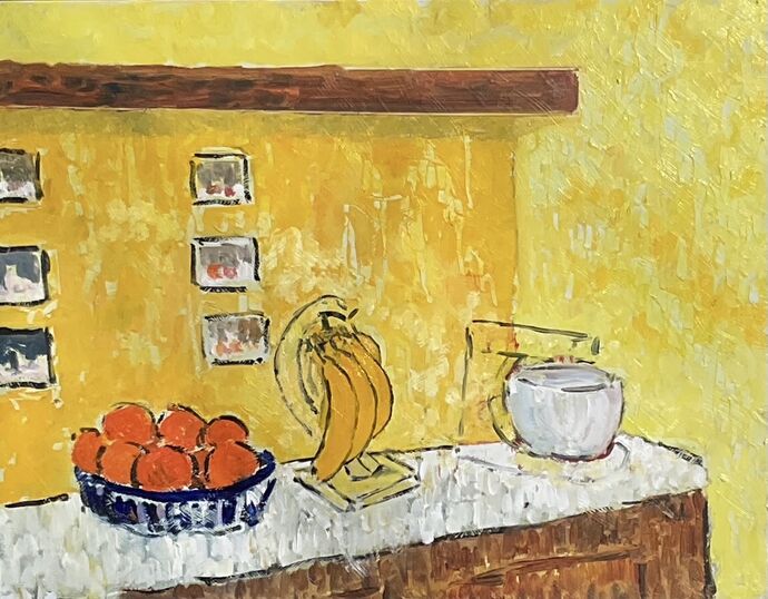 Bananas and oranges in the kitchen.