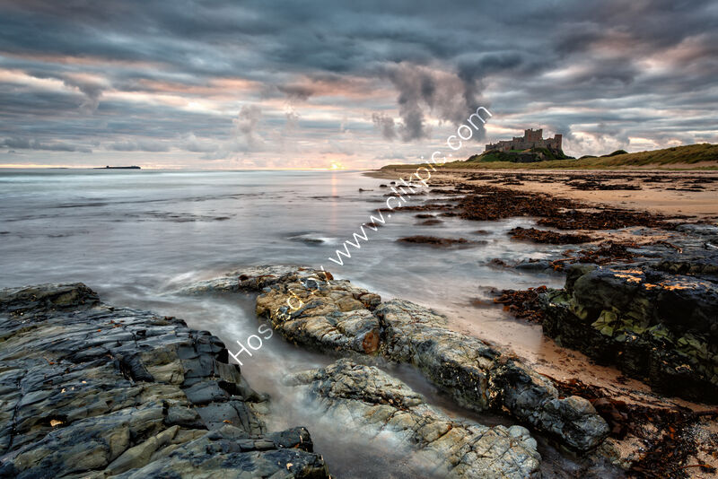 AUTUMN DAWN BAMBURGH SHORELINE by Mike Arblaster