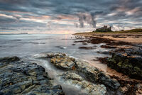 AUTUMN DAWN BAMBURGH SHORELINE by Mike Arblaster