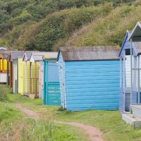 BEACH HUTS by Malcolm Neal