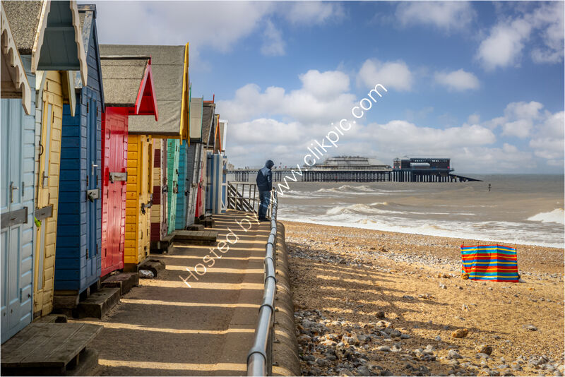 BRAVING THE WIND, CROMER by Neil Partridge