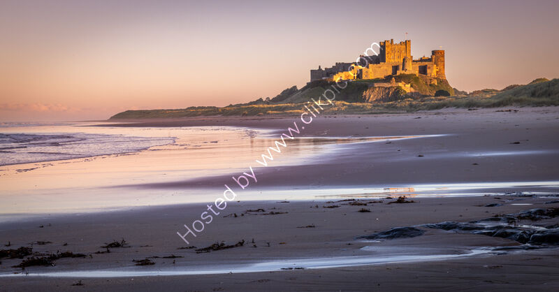 EVENING LIGHT ON BAMBURGH CASTLE by Mike Arblaster