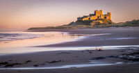 EVENING LIGHT ON BAMBURGH CASTLE by Mike Arblaster