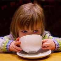 LITTLE GIRL BIG CUP by Derrick Tuplin