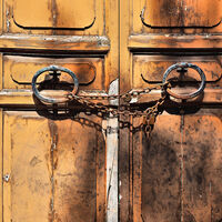 OLD CHAINED UP DOOR ITALY by Frank Reeder