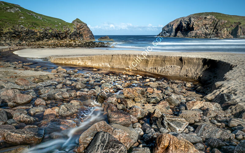STREAM FLOWS TO DALBEG BEACH by Neal Partridge