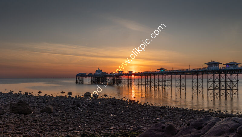 SUNRISE OVER THE PIER by Christine Maughan