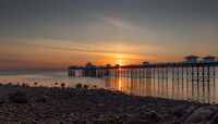 SUNRISE OVER THE PIER by Christine Maughan