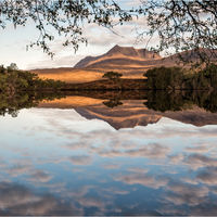 SUNRISE REFLECTION OVER THE COIGACH HILLS by Mark Constable