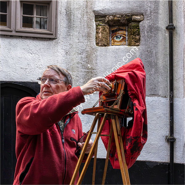 WATCHING A BRISTOL STREET PHOTOGRAPHER by David Harrison