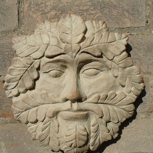 ceramic 'stone' green man wall art by dei ceramics