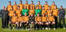 The Dumbarton Football Club manager and team with the Scottish third division trophy.