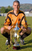 Dumbarton Football Club captain Gordon Lennon, who sadly died in an accident a few weeks later, with the Scottish third division trophy.