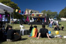 Attendees at the 2010 Brisbane Pride Fair Day relax and enjoy the entertainment on the main stage.