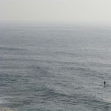 Lone figure at sea