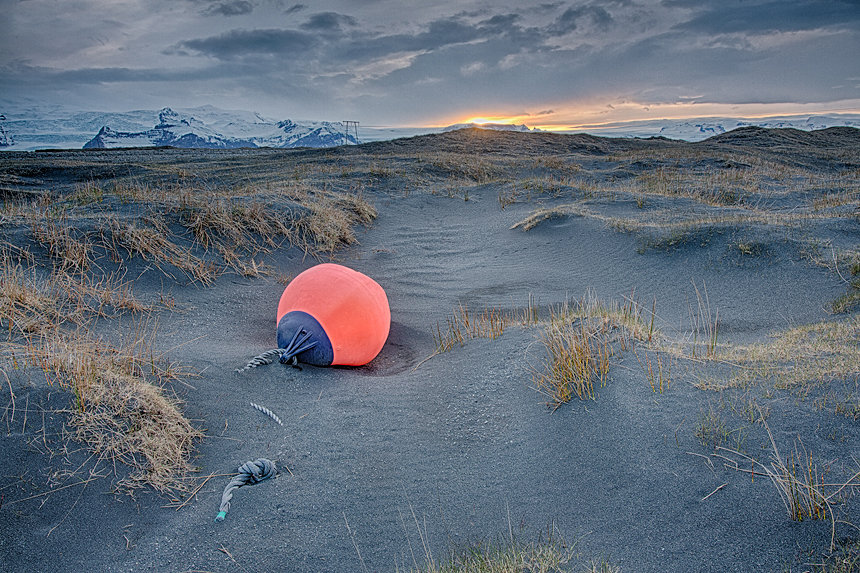 A washed-up buoy in the sand and gravel dunes near Jökulsárlón glacial lake, Iceland.