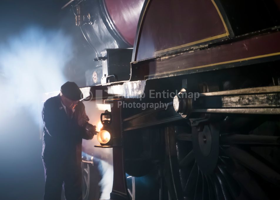 Railway worker lubrication a Midland Railway 1000 Class Locomotive at Barrow Hill Roundhouse ,