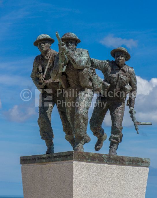 The centrepiece of The British Normandy Memorial,Ver-sur-Mer in Normandy, France. is a a bronze statue trio of soldiers surging forward by the British artist David Williams-Ellis
