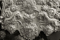 Ornate silver plate around a Torah scroll