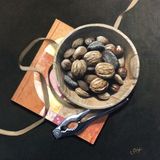 Bowl of Nuts on Art Book