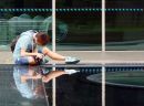 Young photographer reviewing his pictures