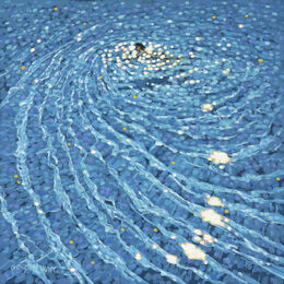 A person swims in the sparkling swimming pool, all on their own
