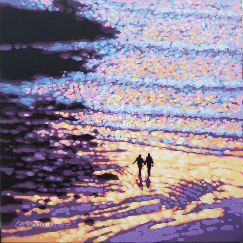 A couple walk on the beach. Gordon Hunt