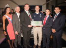 A cheque for Wooden Spoon charity