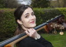 Girl carrying double bass at Shipley Arts festival