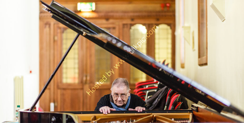 Irwin Schmidt prepping piano