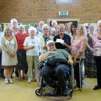 Liz Hunt and group pic of donation to Leonard Cheshire Homes July 2014