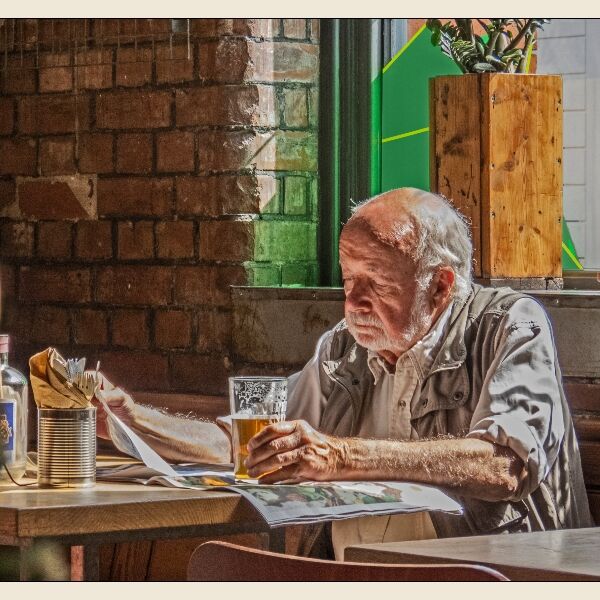 Print: Engrossed in the Paper by Bruce Gibbs-Highly Commended