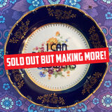 I Can Buy Myself Flowers vintage plate This stunning vintage plate features a a navy and gold trim and flowers in the centre. The text 'I can buy myself flowers' is laid over the flowers.