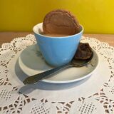 'Art Tea' blue cup with dunked Ginger Nut & tea bag on the side