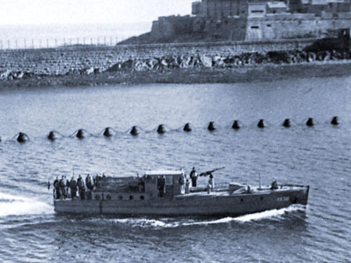 A German Boat enters St Peter Port Harbour.