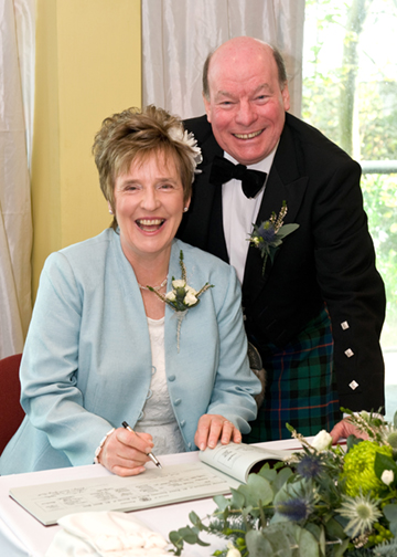 Signing the register.