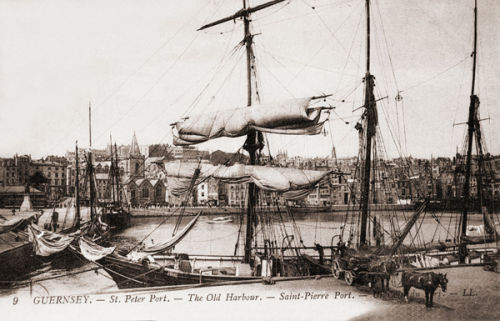 A Sailing ship loading in the old harbour.
