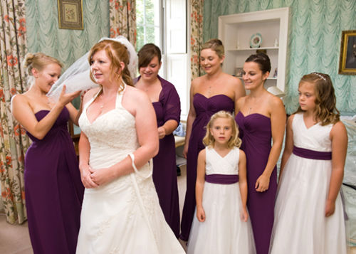 The bride prepares with her attendants.