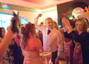 The bride, groom, and friends at the dance.