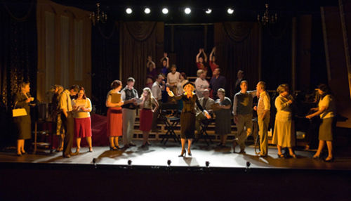 The cast on stage .