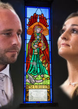 Tracey&James beside a stained glass window