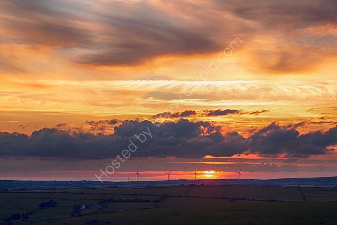 Golden sun set over Camelford from Rough Tor Bodmin Moor Cornwall