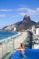 Women in rooftop pool, Ipanema beach, Rio de Janiero, Brazil