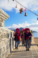 Women praying at stupa, Lugu Lake, Yunnan, China