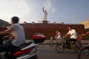 Cyclists Passing Mao, Chengdu, Sichuan