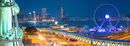 Ferris wheel and Kowloon skyline at dusk, Hong Kong