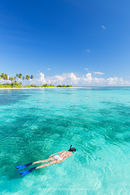 Woman snorkelling, Maldives